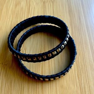 Black bangle bracelets.